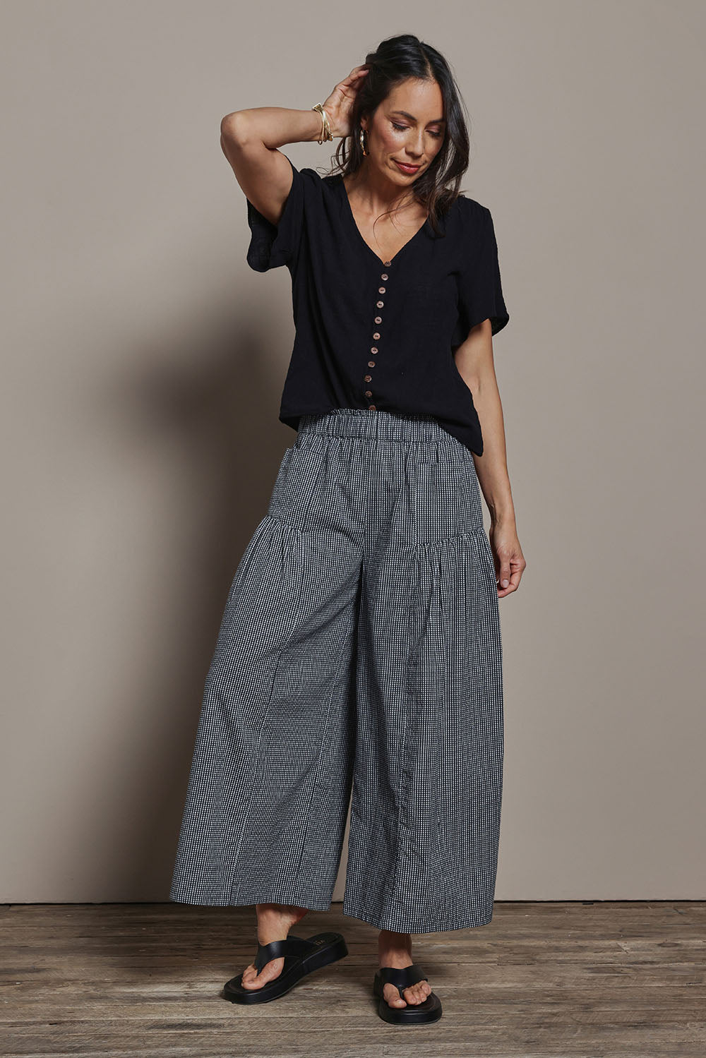 Model Amanda wearing size 10 of the Break Of Day Cotton Pants in colour Blackcheck (Black), from the front, showing the whole outfit