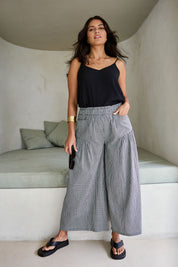 Model Tahnee wearing size 10 of the Break Of Day Cotton Pants in colour Blackcheck (Black), from the front, showing the whole outfit