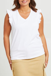 Model Monique wearing size 14 of the For The Frill Of It Tee in colour White (White), from the front, cropped image