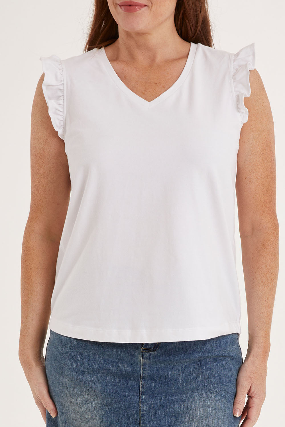 Model Sally wearing size 10 of the For The Frill Of It Tee in colour White (White), from the front, cropped image