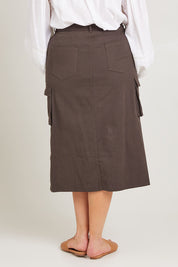 Model Poppy wearing size 16 of the Carry Me With You Cargo Skirt in colour Concrete (Grey), from the back