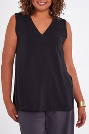 Model Anucia wearing size 14 of the Snuggle Up Vest in colour Black (Black), from the front, cropped image