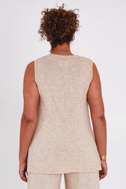 Model Anucia wearing size 14 of the Snuggle Up Vest in colour Sand, from the back