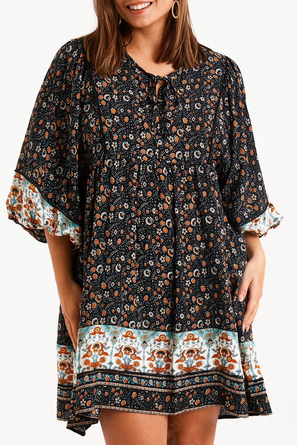 Model Monique wearing size 14 of the Sunset Dreamer Dress in colour Blkfleur (Black), from the front, cropped image