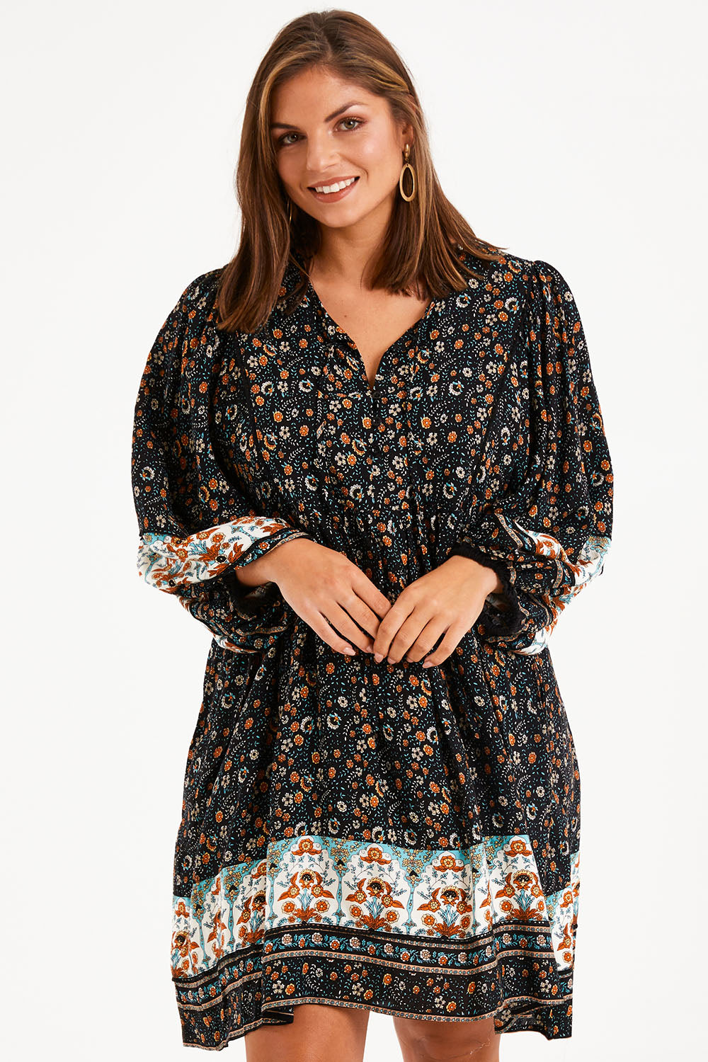 Model Monique wearing size 14 of the Sunset Dreamer Dress in colour Blkfleur (Black), from the front, cropped image