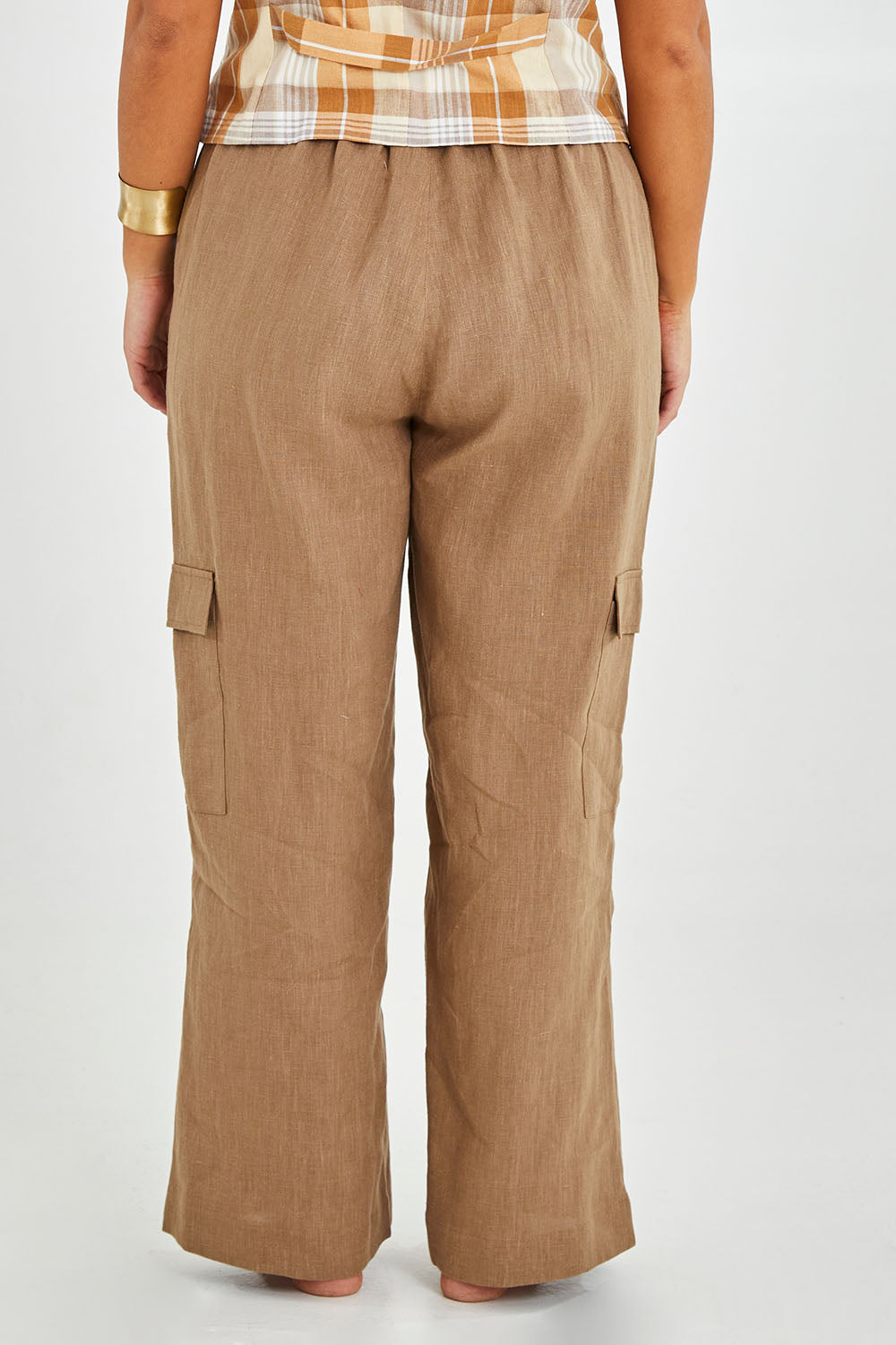Model Monique wearing size 14 of the Always In Style Linen Cargo Pant in colour Camel, from the back