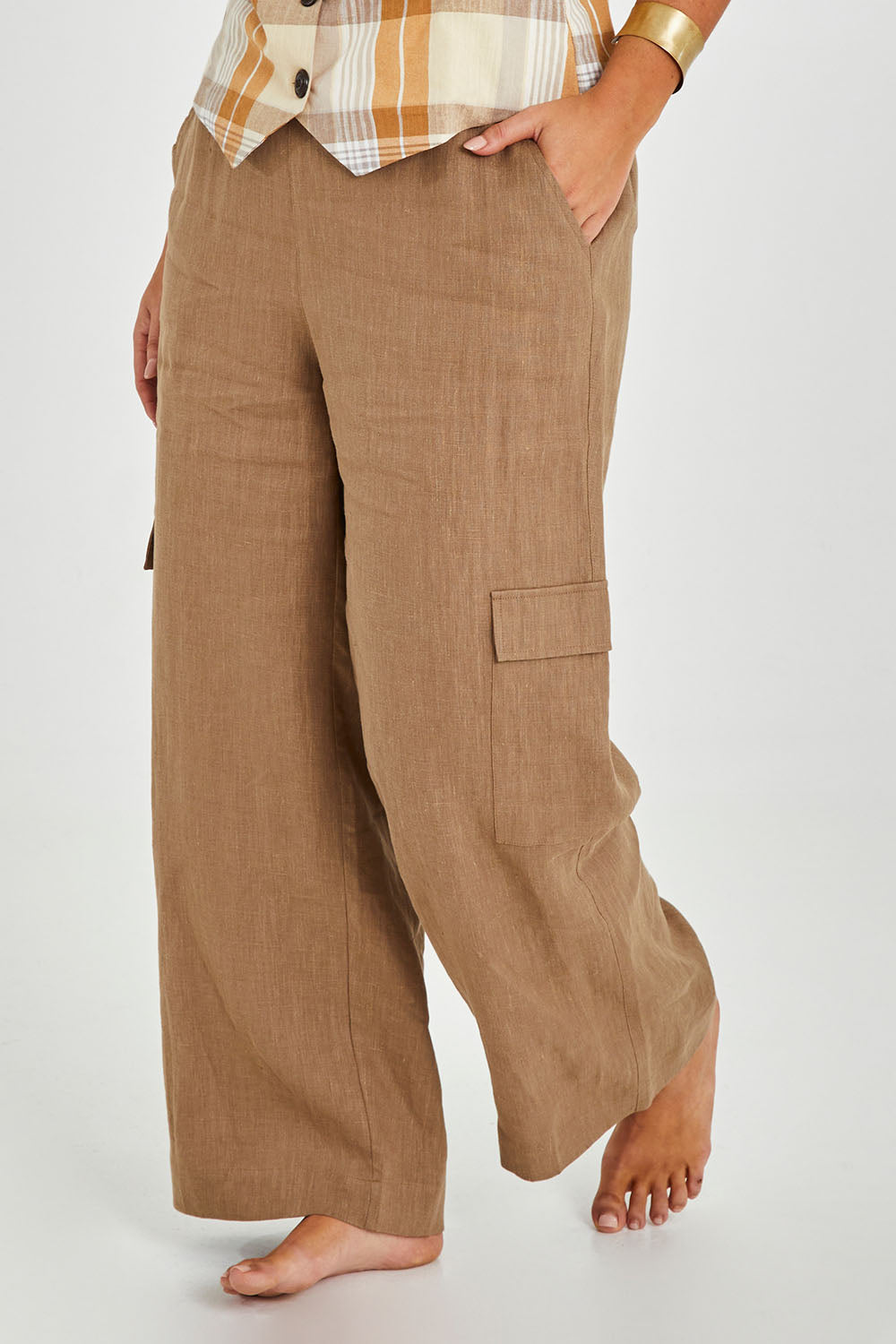 Model Monique wearing size 14 of the Always In Style Linen Cargo Pant in colour Camel, from the front, cropped image