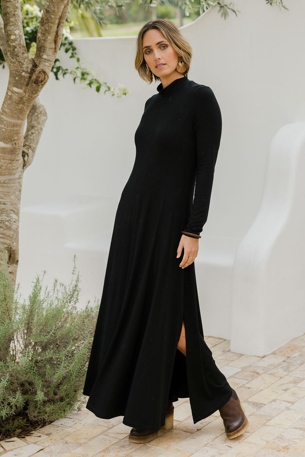 Model Tegan wearing size 10 of the My Faithful Maxi Tee Skivvy Dress in colour Black (Black), from the front, showing the whole outfit