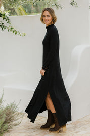 Model Tegan wearing size 10 of the My Faithful Maxi Tee Skivvy Dress in colour Black (Black), from the front, showing the whole outfit