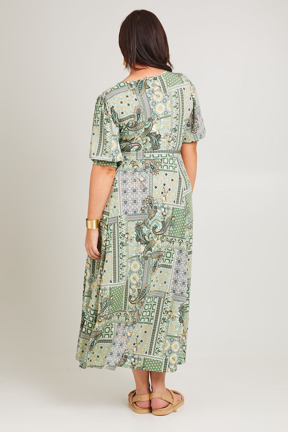 Model Poppy wearing size 16 of the All I Need Is You Mid Sleeve Dress in colour Mintpatch (Green), from the back