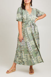 Model Poppy wearing size 16 of the All I Need Is You Mid Sleeve Dress in colour Mintpatch (Green), from the front, cropped image