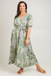 Model Poppy wearing size 16 of the All I Need Is You Mid Sleeve Dress in colour Mintpatch (Green), from the front, showing the whole outfit