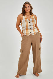 Model Monique wearing size 14 of the Ready And Able Checked Vest in colour Check, from the front, showing the whole outfit