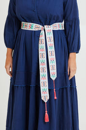 Model Laura wearing size M-L of the Finishing Touch Embroidered Belt in colour Geopale (Blue), from the front, cropped image