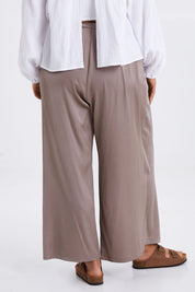 Model Monique wearing size 14 of the Going With The Flow Overlay Pants in colour Bungee, from the back