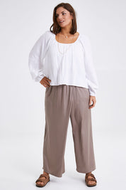 Model Monique wearing size 14 of the Going With The Flow Overlay Pants in colour Bungee, from the front, showing the whole outfit