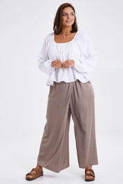 Model Monique wearing size 14 of the Going With The Flow Overlay Pants in colour Bungee, from the front, showing the whole outfit