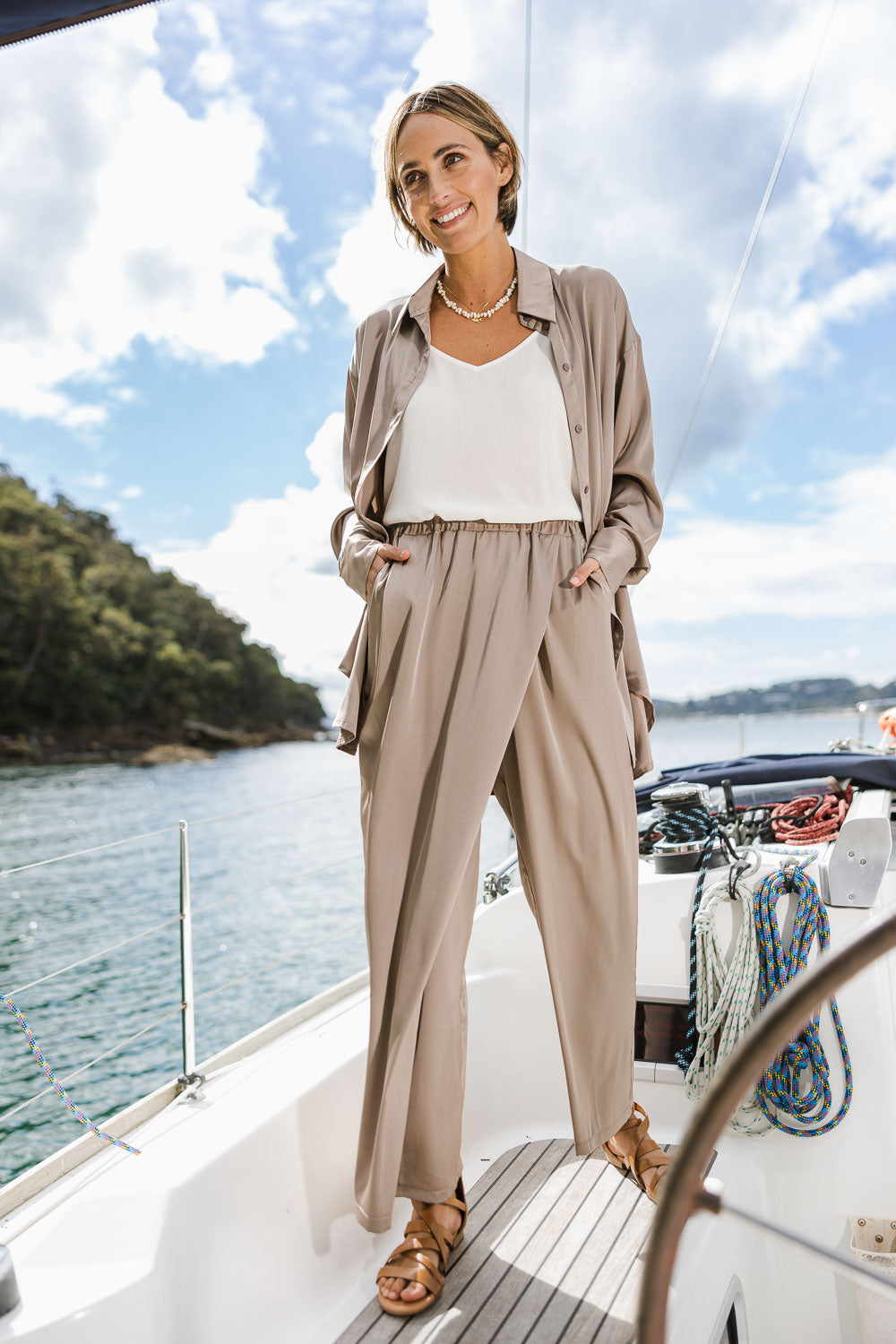 Model Naomi wearing size 10 of the Going With The Flow Overlay Pants in colour Bungee, from the front, showing the whole outfit