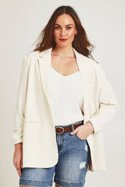 Model Jane wearing size 14 of the Elegant Persuasion Ruched Sleeved Oversized Blazer in colour Cream, from the front, cropped image