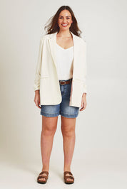 Model Jane wearing size 14 of the Elegant Persuasion Ruched Sleeved Oversized Blazer in colour Cream, from the front, showing the whole outfit