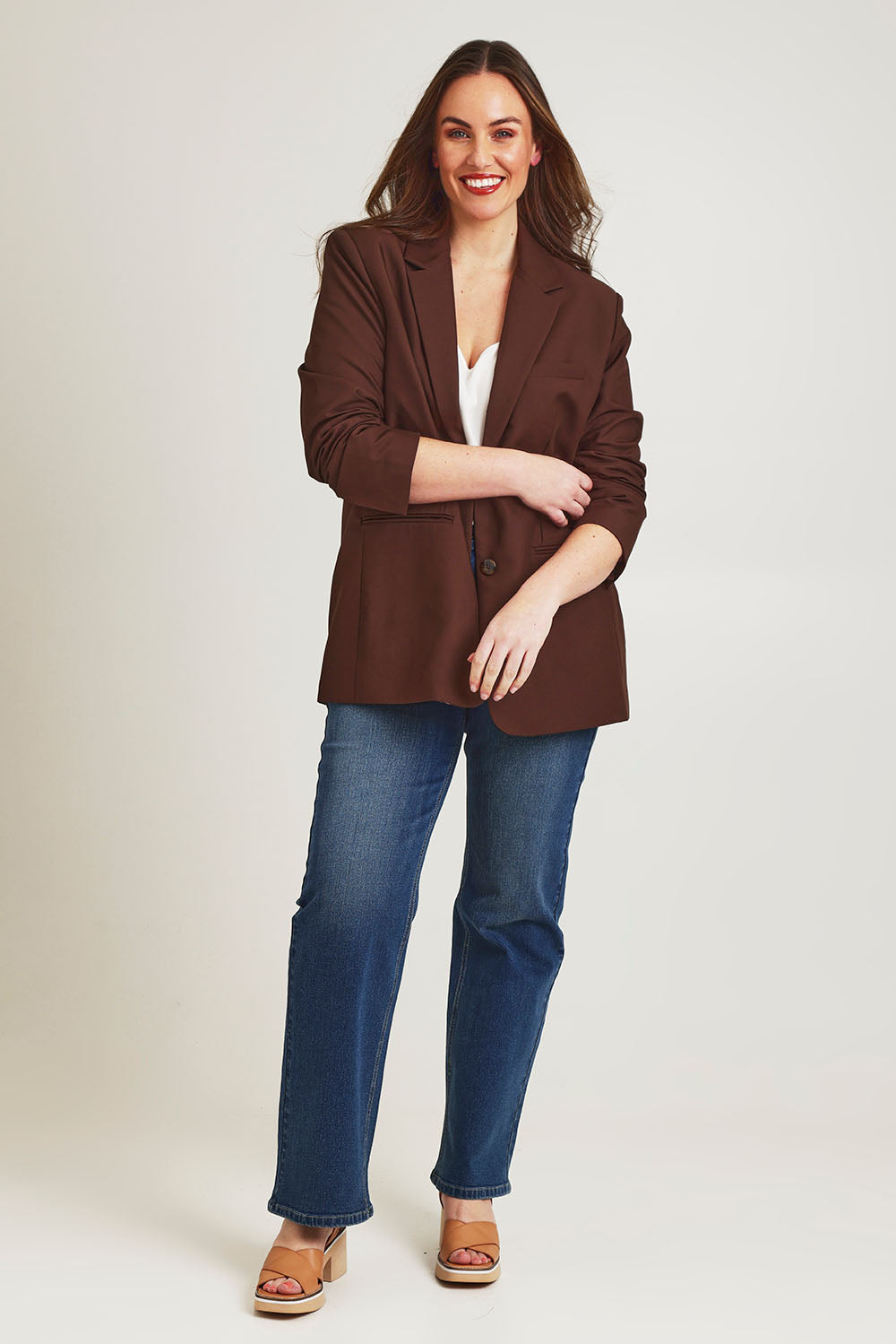Model Jane wearing size 14 of the Elegant Persuasion Oversized Blazer in colour Chocolate, from the front, showing the whole outfit