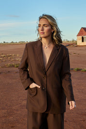 Model Tegan wearing size 10 of the Elegant Persuasion Oversized Blazer in colour Chocolate, from the front, showing the whole outfit
