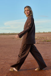 Model Tegan wearing size 10 of the Elegant Persuasion Oversized Blazer in colour Chocolate, from the front, showing the whole outfit