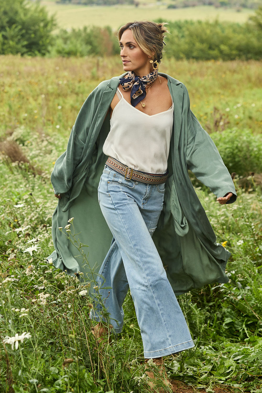 Model Tegan wearing size 10 of the Rendezvous Cupro Jacket in colour Ivy (Green), from the front, showing the whole outfit
