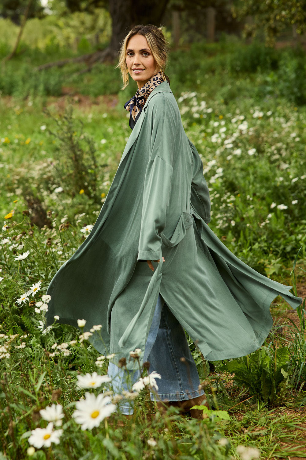 Model Tegan wearing size 10 of the Rendezvous Cupro Jacket in colour Ivy (Green), from the front, showing the whole outfit
