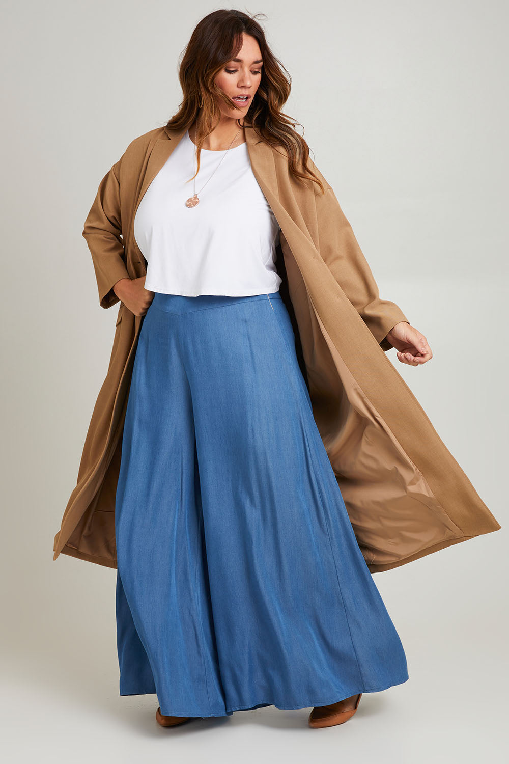 Model Laura wearing size 14 of the Suits Me Long Jacket in colour Earth, from the front, showing the whole outfit