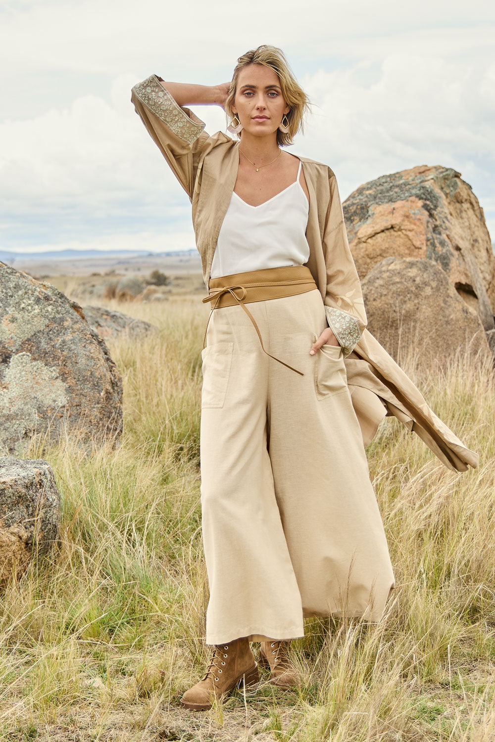 Model Tegan wearing size 10 of the Serene Day Wide Leg Pants in colour Sand, from the front, showing the whole outfit