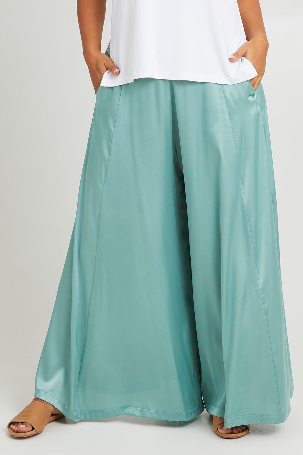 Model Monique wearing size 14 of the Going With The Flow Wide Leg Pants in colour Sage (Green), from the front, cropped image
