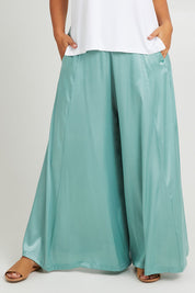 Model Monique wearing size 14 of the Going With The Flow Wide Leg Pants in colour Sage (Green), from the front, cropped image