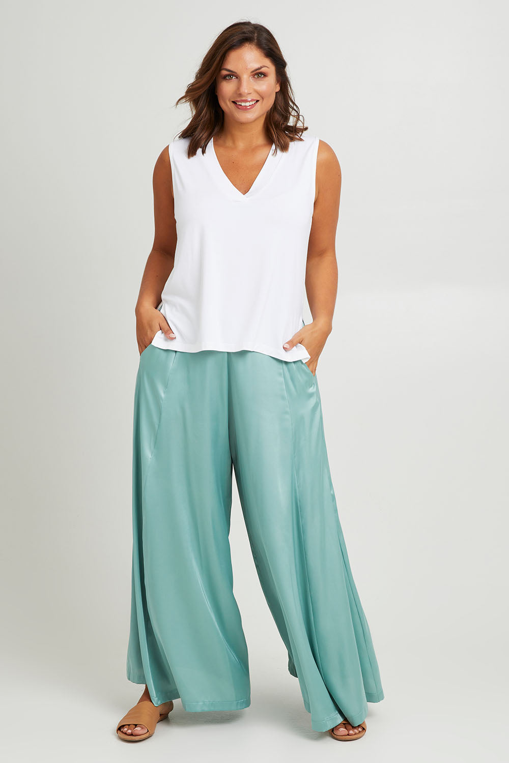 Model Monique wearing size 14 of the Going With The Flow Wide Leg Pants in colour Sage (Green), from the front, showing the whole outfit