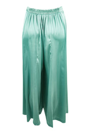 Product shot of the Going With The Flow Wide Leg Pants in colour Sage (Green), from the back