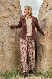 Model Tegan wearing size 10 of the Swept Away By You Pant in colour Tribe, from the front, showing the whole outfit