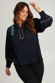 Model Laura wearing size 14 of the Say You Love Me Blouse in colour Black (Black), from the front, cropped image