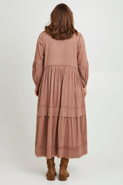 Model Monique wearing size 14 of the Real Love Tiered Dress in colour Umber, from the back