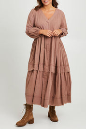 Model Monique wearing size 14 of the Real Love Tiered Dress in colour Umber, from the front, cropped image