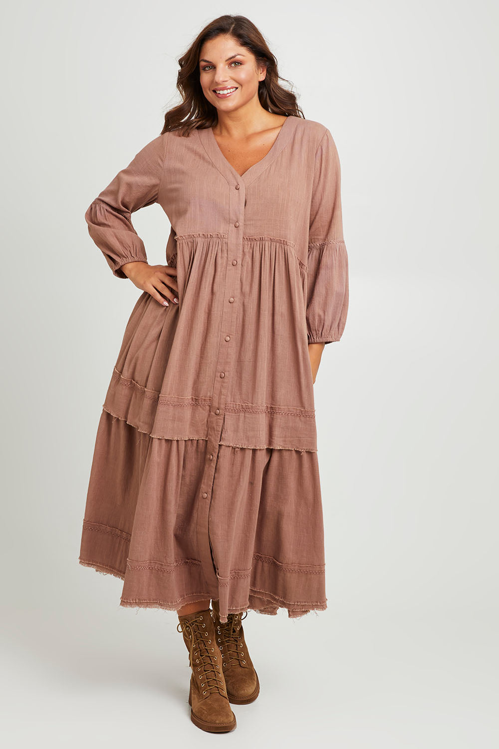 Model Monique wearing size 14 of the Real Love Tiered Dress in colour Umber, from the front, showing the whole outfit