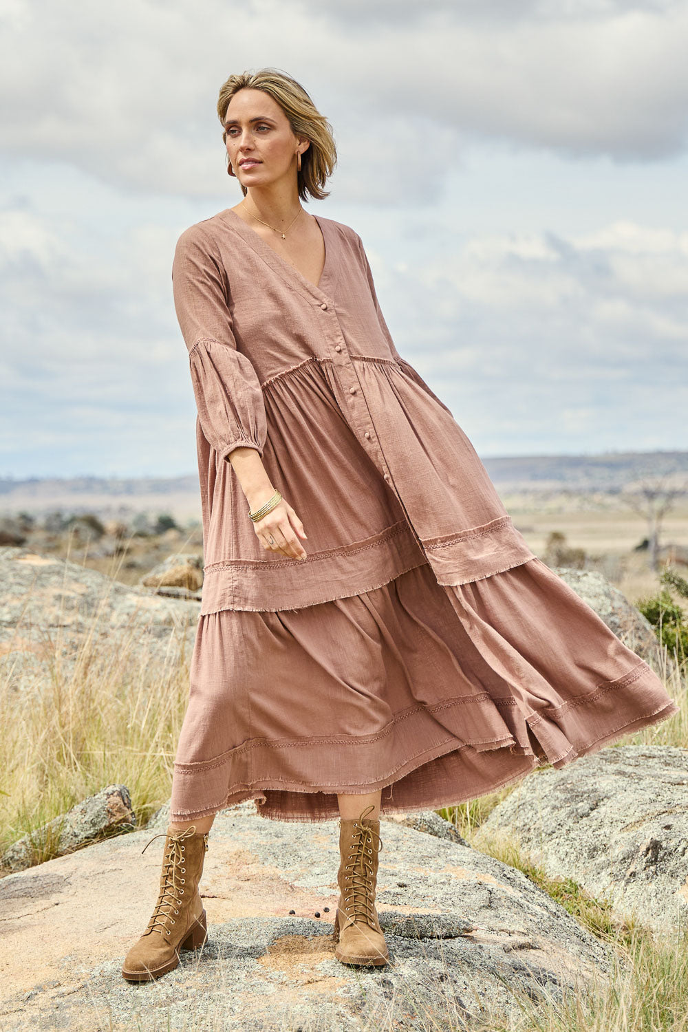 Model Tegan wearing size 10 of the Real Love Tiered Dress in colour Umber, from the front, showing the whole outfit