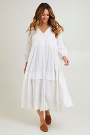 Model Laura wearing size 14 of the Real Love Tiered Dress in colour White (White), from the front, showing the whole outfit