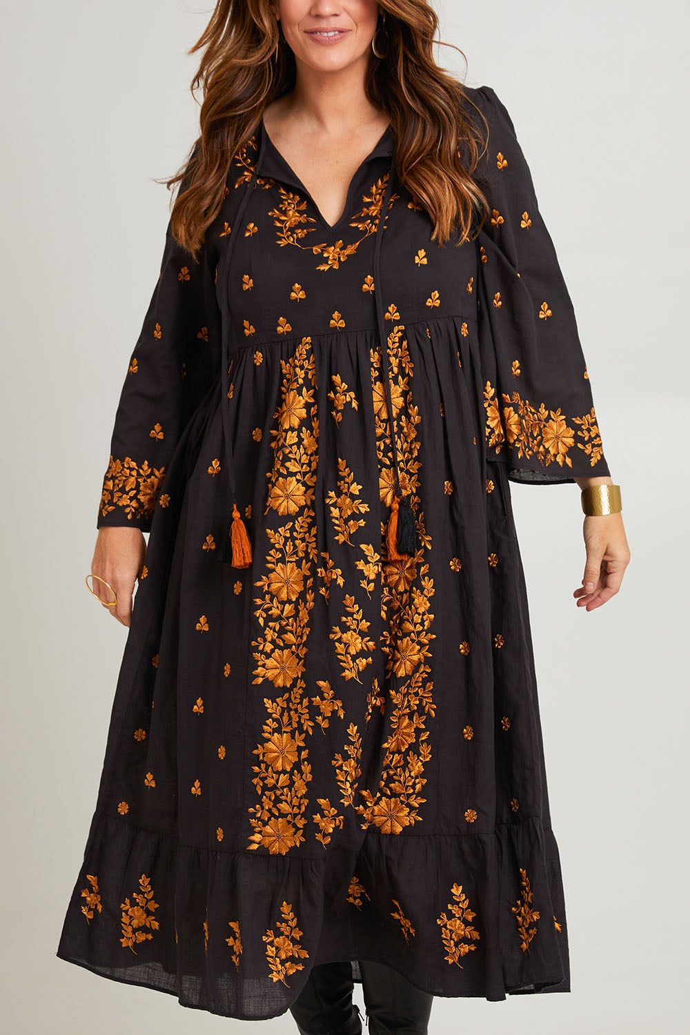 Model Laura wearing size 14 of the Dancing With Joy Dress in colour Black (Black), from the front, cropped image