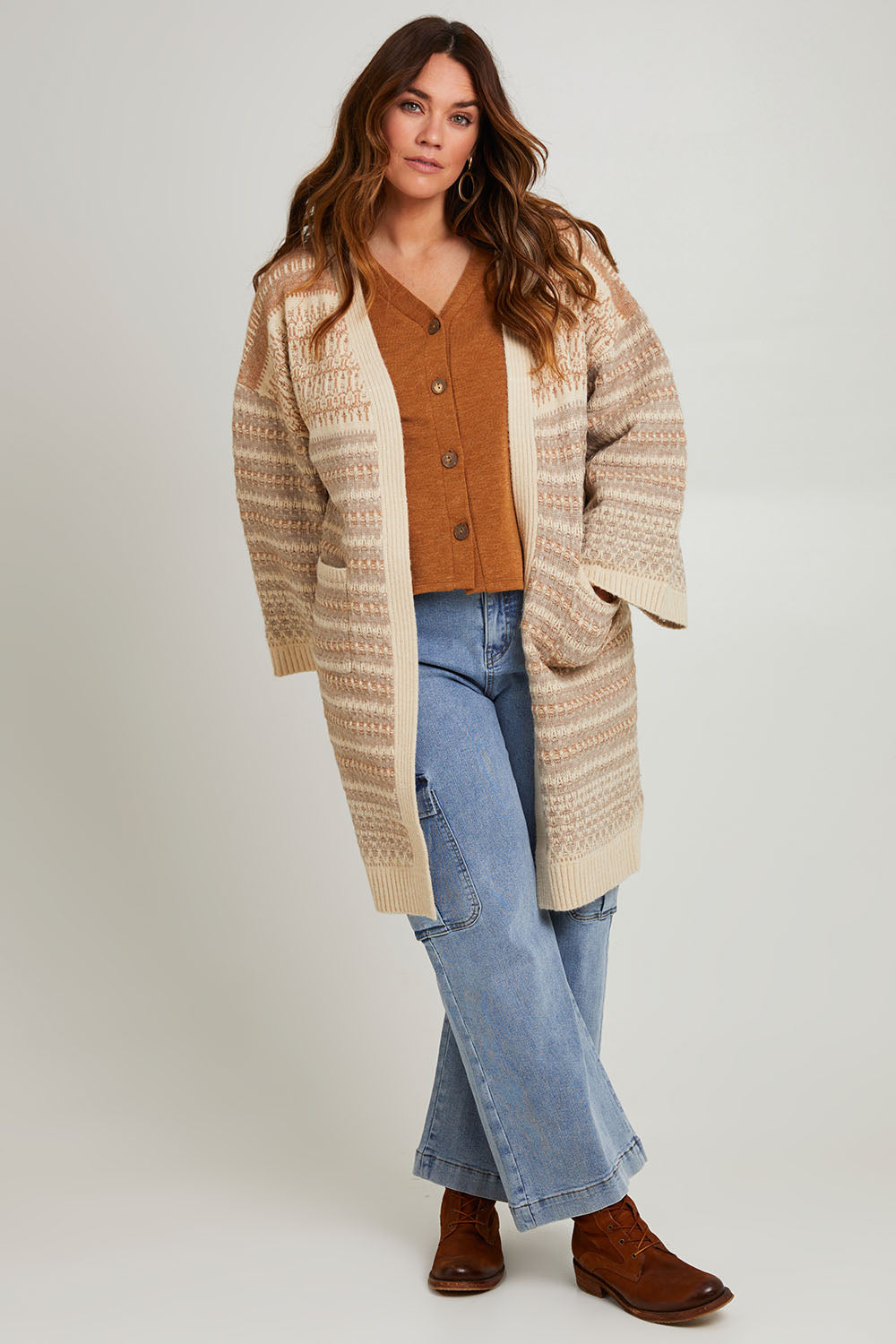 Model Laura wearing size S of the Mountain Dreaming Oversized Cardi in colour Naturals, from the front, showing the whole outfit