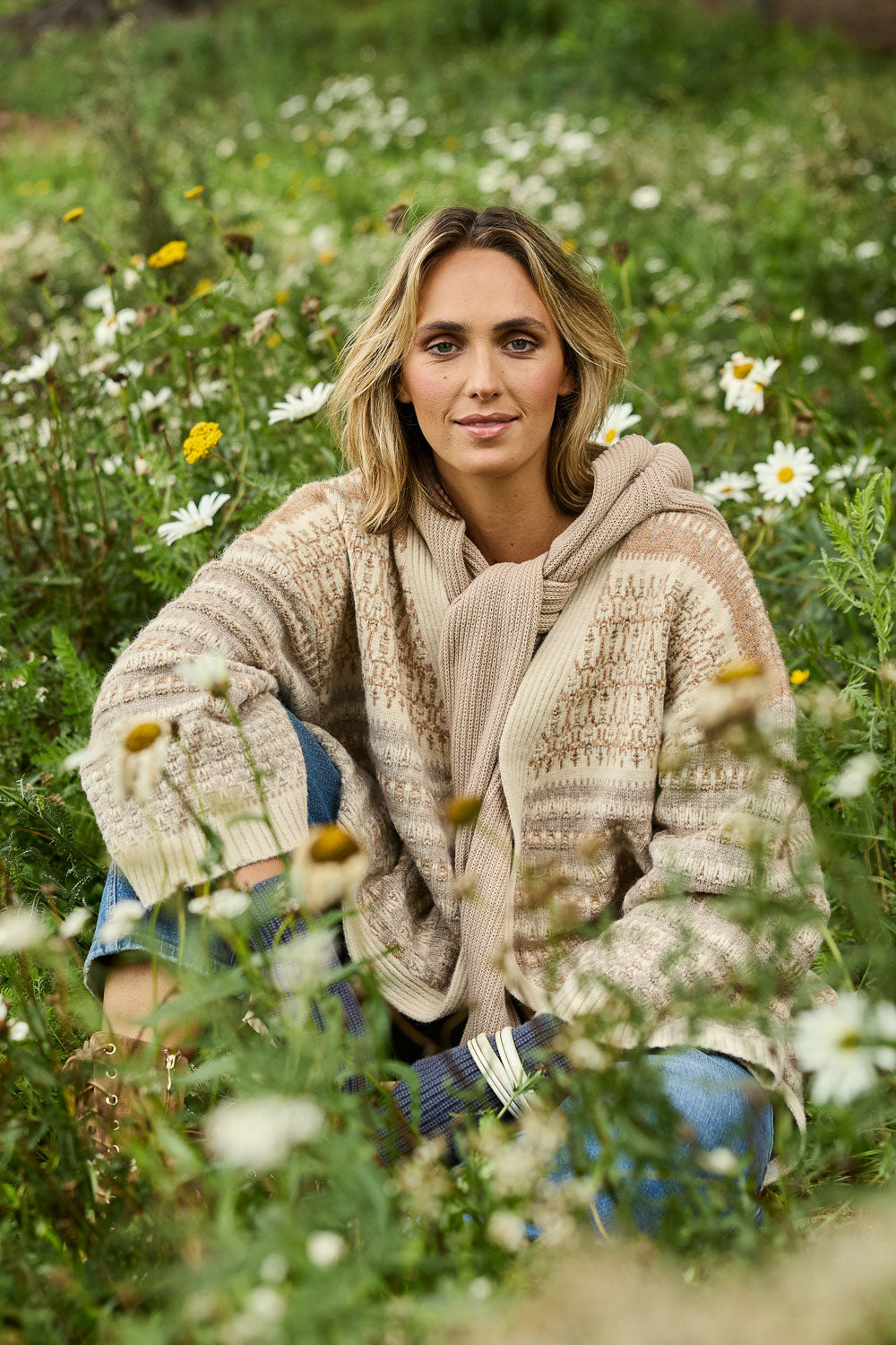 Model Tegan wearing size S of the Mountain Dreaming Oversized Cardi in colour Naturals, from the front, showing the whole outfit