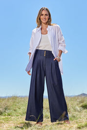Model Tegan wearing size 10 of the High Flying Wide Leg Chambray Pants in colour Darkdenim (Blue), from the front, showing the whole outfit
