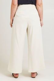 Model Jane wearing size 14 of the High Flying Wide Leg Pants in colour Cream, from the back