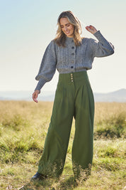Model Tegan wearing size 10 of the High Flying Wide Leg Pants in colour Pine (Green), from the front, showing the whole outfit