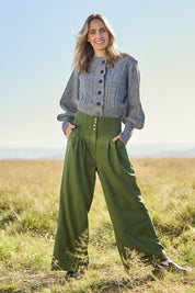 Model Tegan wearing size 10 of the High Flying Wide Leg Pants in colour Pine (Green), from the front, showing the whole outfit
