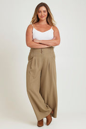 Model Chanel wearing size 16 of the High Flying Wide Leg Pants in colour Pumice, from the front, showing the whole outfit
